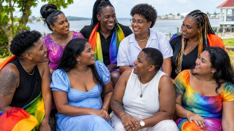 Diverse Caribbean LGBTQ+ community members together, representing respect and inclusion in Guyana
